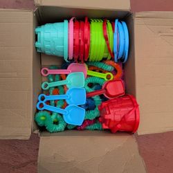 Box Of Assorted sand Castle Molds Shovels And Leis 