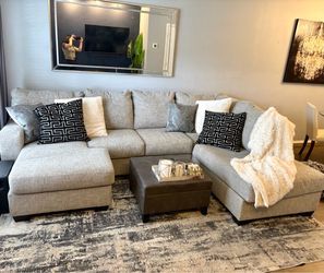 Sectional Couch/Ottoman Set with Abstract Rug