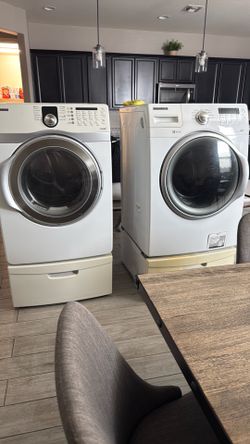 White Samsung washer & dryer set with drawer pedestal
