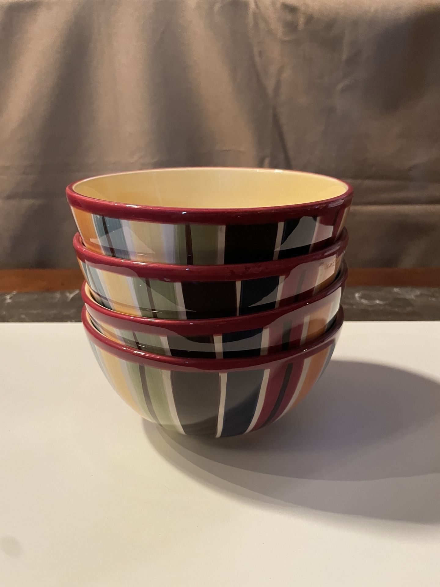 4 soup/cereal bowls. These pieces are part of the Avellino Amherst collection by Tabletops Unlimited  Width: 6 1/2 in Height: 3 1/8 in Earthenware