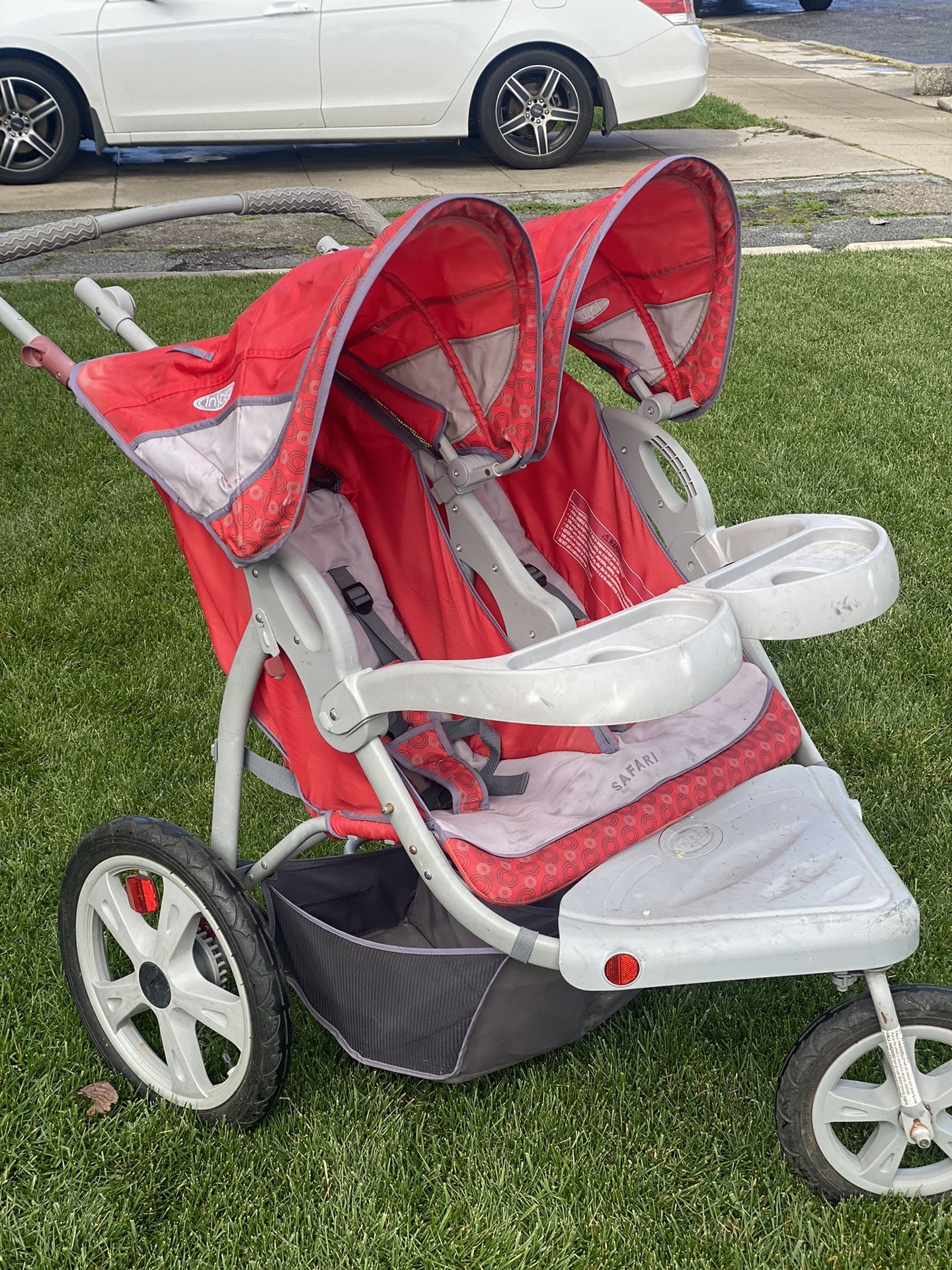 InStep Grand Safari Swivel Wheel Double Jogging Stroller - RED