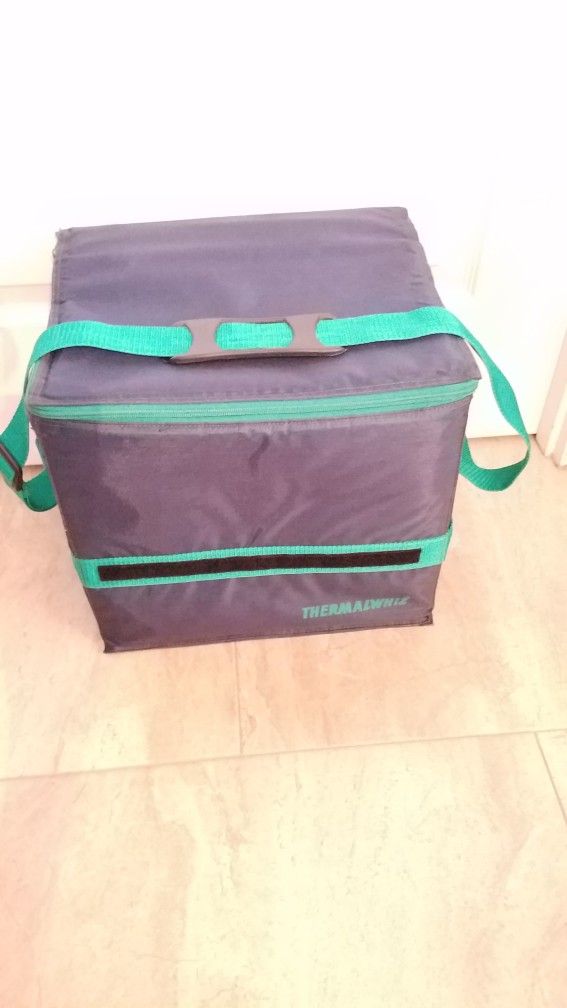 NEW COOLER, UNIQUE DESIGN, THICK & STURDY & LIGHT, ZIPPER CLOSURE, BLUE WITH GREEN TRIMS, ADJUST HANDLE, WHEN EMPTY IT FOLDS WITH VELCROS,