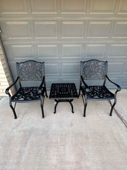 Patio set. Chairs and a table. Very nice condition. All metal.