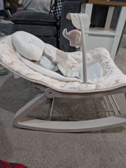 New out of the box Baby Bouncer Rocker with Toy Bar