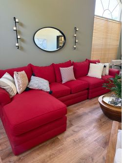 Red Sectional sofa with pillows
