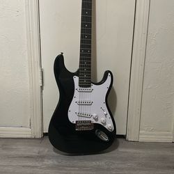 Electric Guitar W carrying case and extra strings