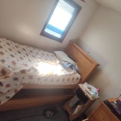 Twin Size Bed Frame With Rollout Storage Drawer Underneath 