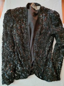 1970s style vintage black sequin jacket.