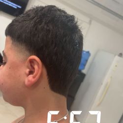 Young barber cutting for free dm