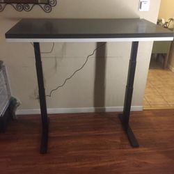 Electric height adjustable table