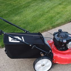 Super nice yard machines by MTD push lawn mower with Briggs & Stratton engine starts as he runs perfect