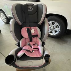 Evenflo Car Seat-12-position adjustable car seat with cup holders.