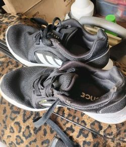 A Pair of Black & White  Adidas Sneakers (Size 7)