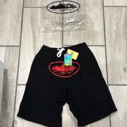 Corteiz red and black shorts