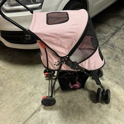 Dog stroller lightly used comes with the little bed to go inside everything on it works