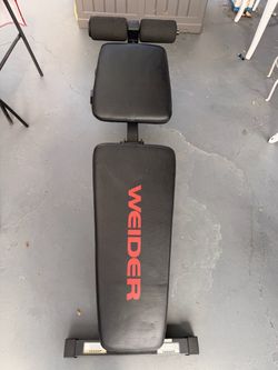 Adjustable multi- position weight bench with leg developer