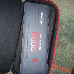 Nexpow 2000 portable battery charger with all accessories.