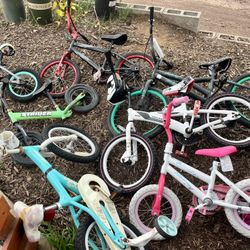 Eight bicycles in different sizes