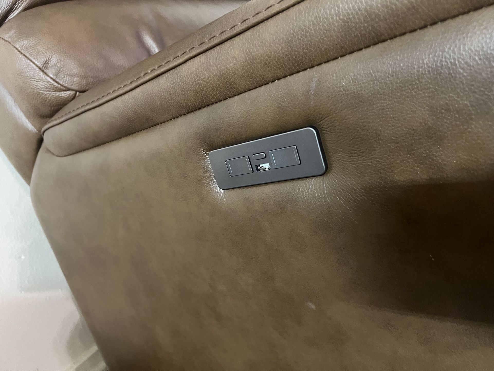 brown single reclining and rocking chair