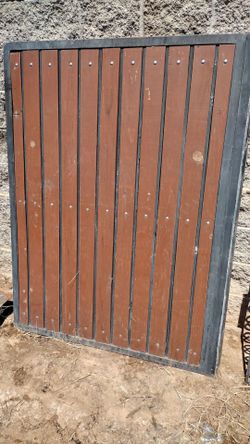 Black metal door gate wood panel. Size. 48" inches wide X .62" inches tall.  $. .165.