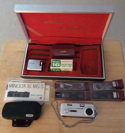 Minolta 16 MG-S camera with accessories and manual