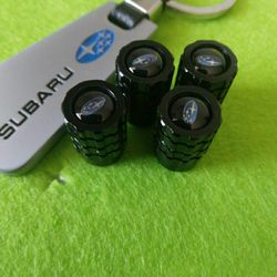 Keychain For Subaru Silver And Stem Caps For Tires $15.