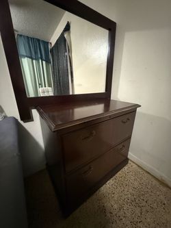 Dark wood dresser with mirror