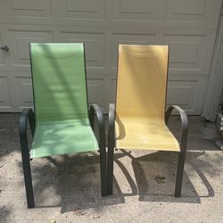 Two lawn chairs outdoor chairs yellow and green stackable