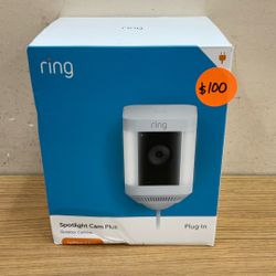 RING PLUG-IN SPOTLIGHT CAM PLUS OUTDOOR CAMERA LIGHT AND SIREN.