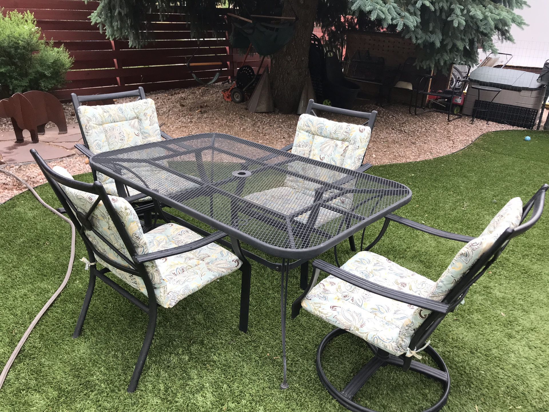 Wrought iron patio table with 4 chairs