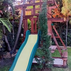 Outdoor Playground With Swings And Slide