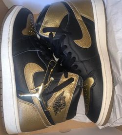 Air Jordan 1 Mid Black and Gold Sneakers