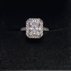 Brand new radiant cut Costume Ring With side stones and band stones.