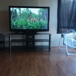 Tv With A Tv stand 