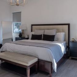 Bed from Bernhardt with a leather headboard wood frame.