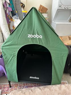 Large elevated doghouse with weather-resistant canopy