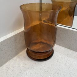 8 inch tall and 5 inch across candle holder clear brown