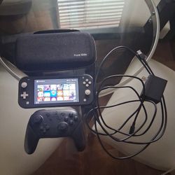 Nintendo Switch Lite + Pro Controller + Games