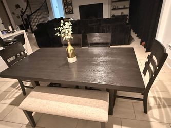 Wooden table with bench and 4 chairs