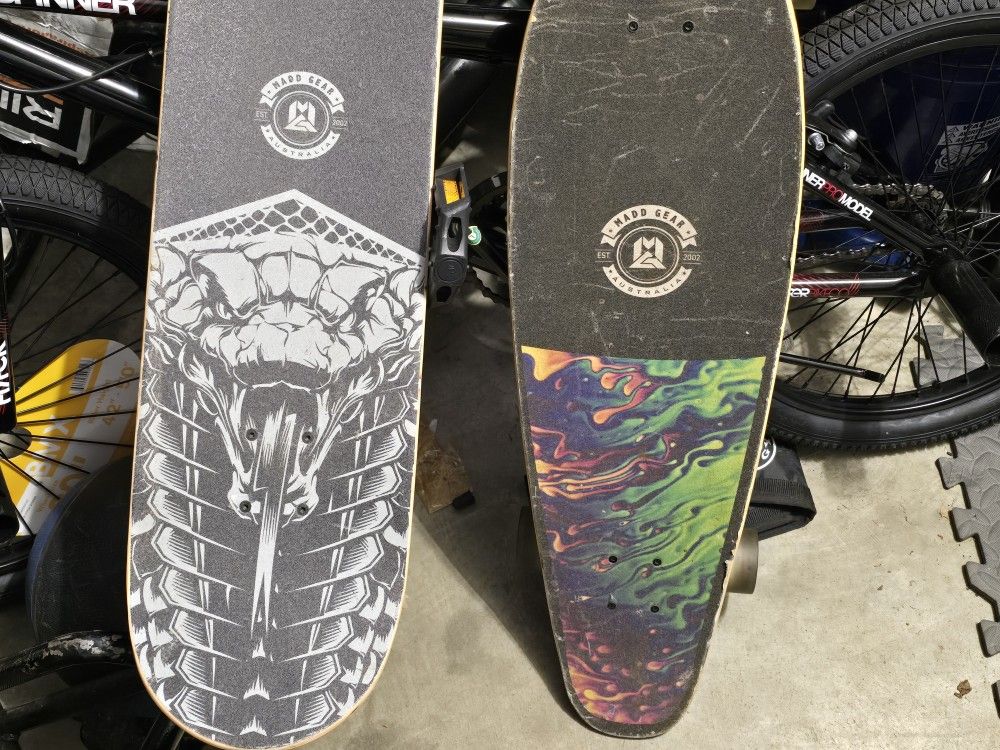 Two Skate Boards And A Bike