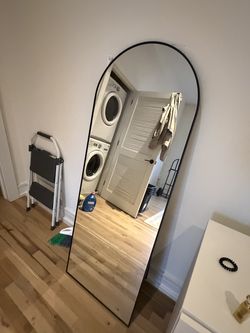 Black rounded mirror