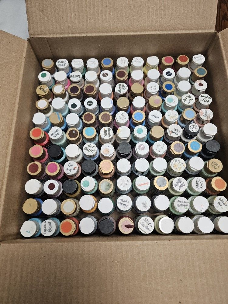 art supplies.  Acrylic paints and paint holder