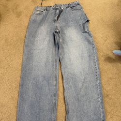 PrettyLittleThing Light Blue Wash Baggy Low Rise Asymmetric Waistband Jeans