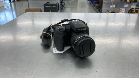 Black Fujifilm FinePix HS20EXR digital bridge camera equipped with a Fujinon 30x optical zoom lens (24mm–720mm)