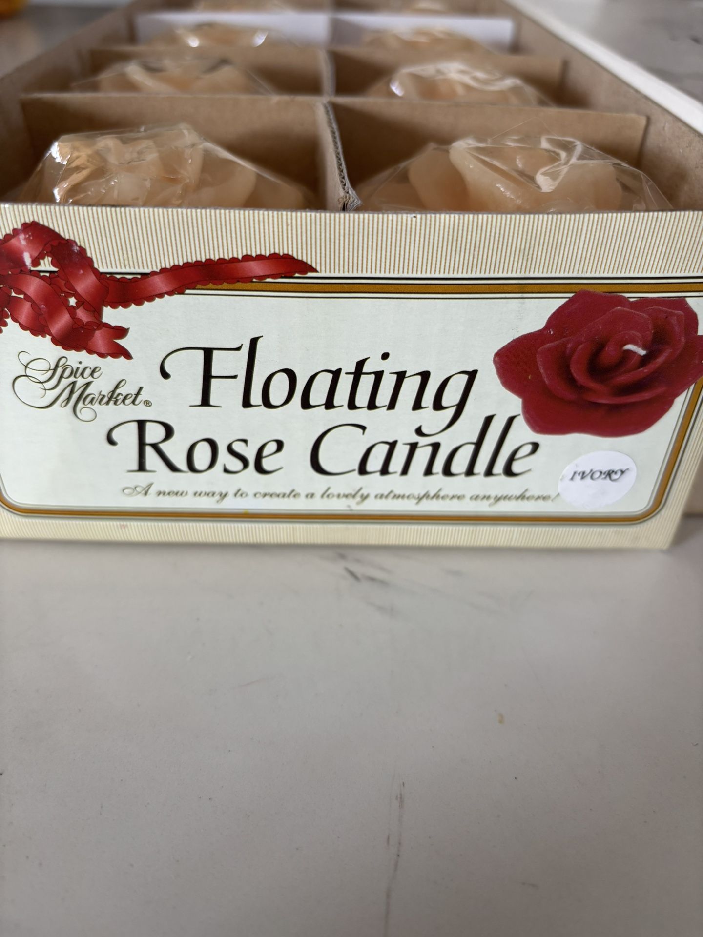  a box of Merkel Amdore floating rose candles. 16 count