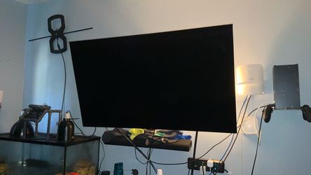 LG OLED55C2PUA  DARK GRAY/BLACK with silver bezel around  size is 55 inches