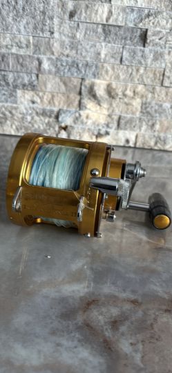 Gold PENN INTERNATIONAL 50S TWO SPEED BIG GAME Fishing Reel with 130 lb Spectra.