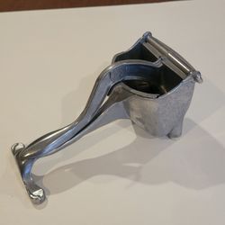 Vintage 1940s Wear-Ever Cast Aluminum Hand Press Citrus Juicer 
w/Perforated Strainer. Made in USA. Pre-owned, in good working and 
cosmetic shape, pl