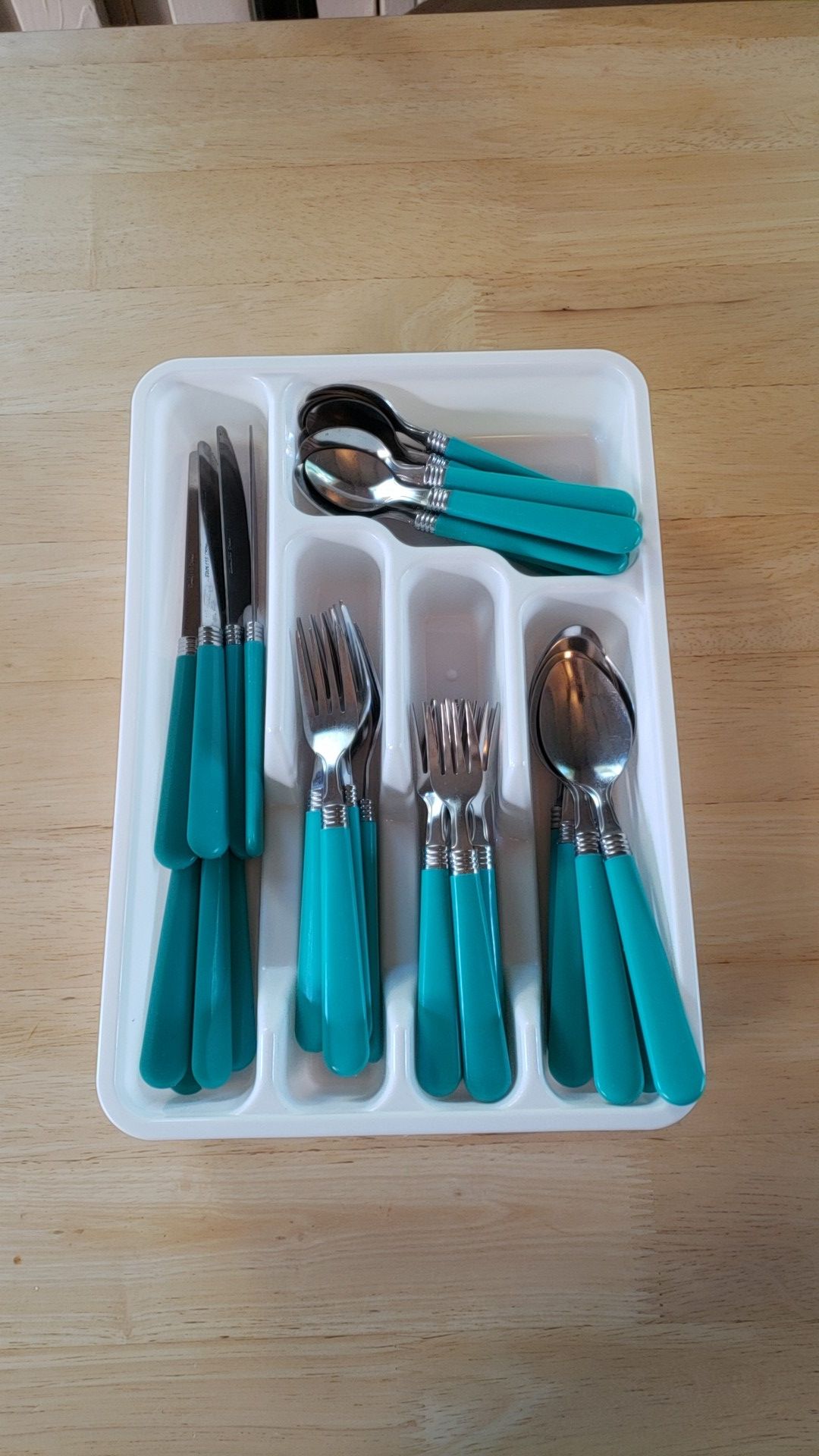 Turquoise silverware set and white devider