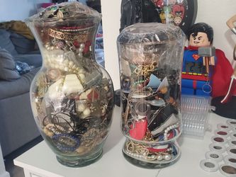 Two Glass Vases Stuffed Full Of Jewelry